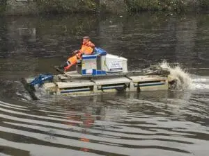 removing sediment from pond